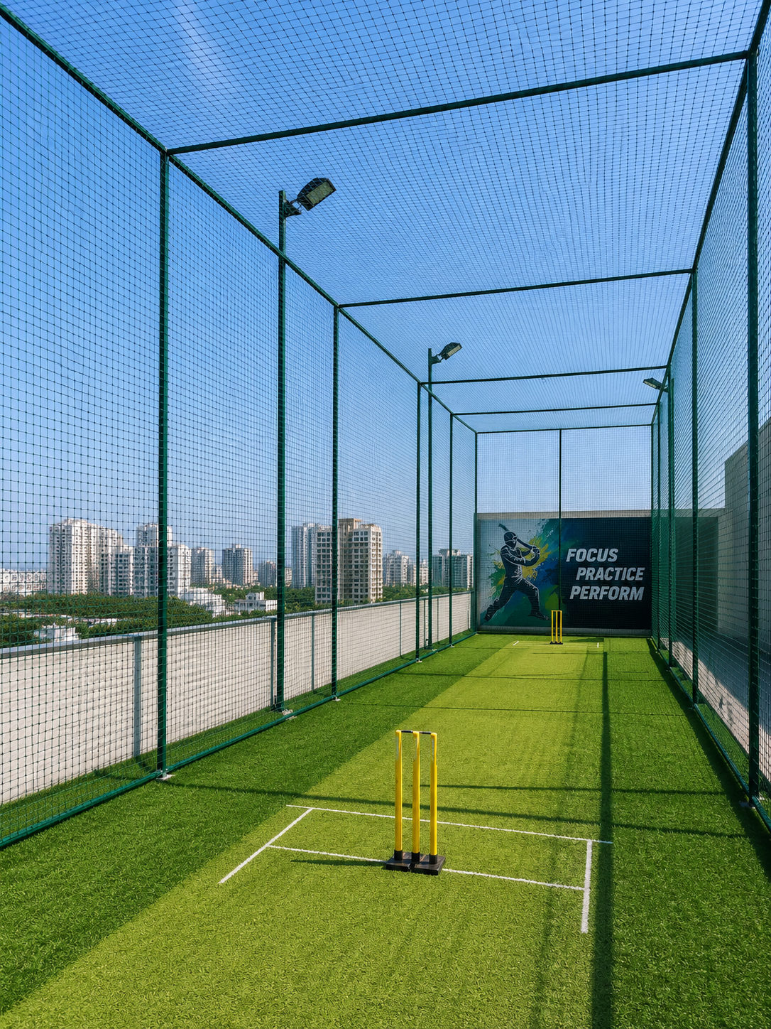 Close-up interior of cricket practice net cage in Andrapradesh — knotted nylon netting under tension with batting crease marked on ground inside the cage