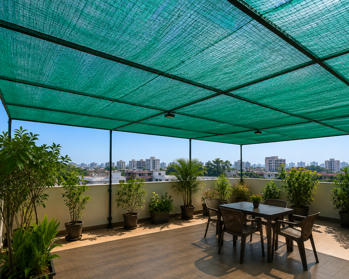 Agricultural shade net over plant nursery in Mangalore — green HDPE shade cloth protecting plants from intense tropical sunlight outdoor nursery