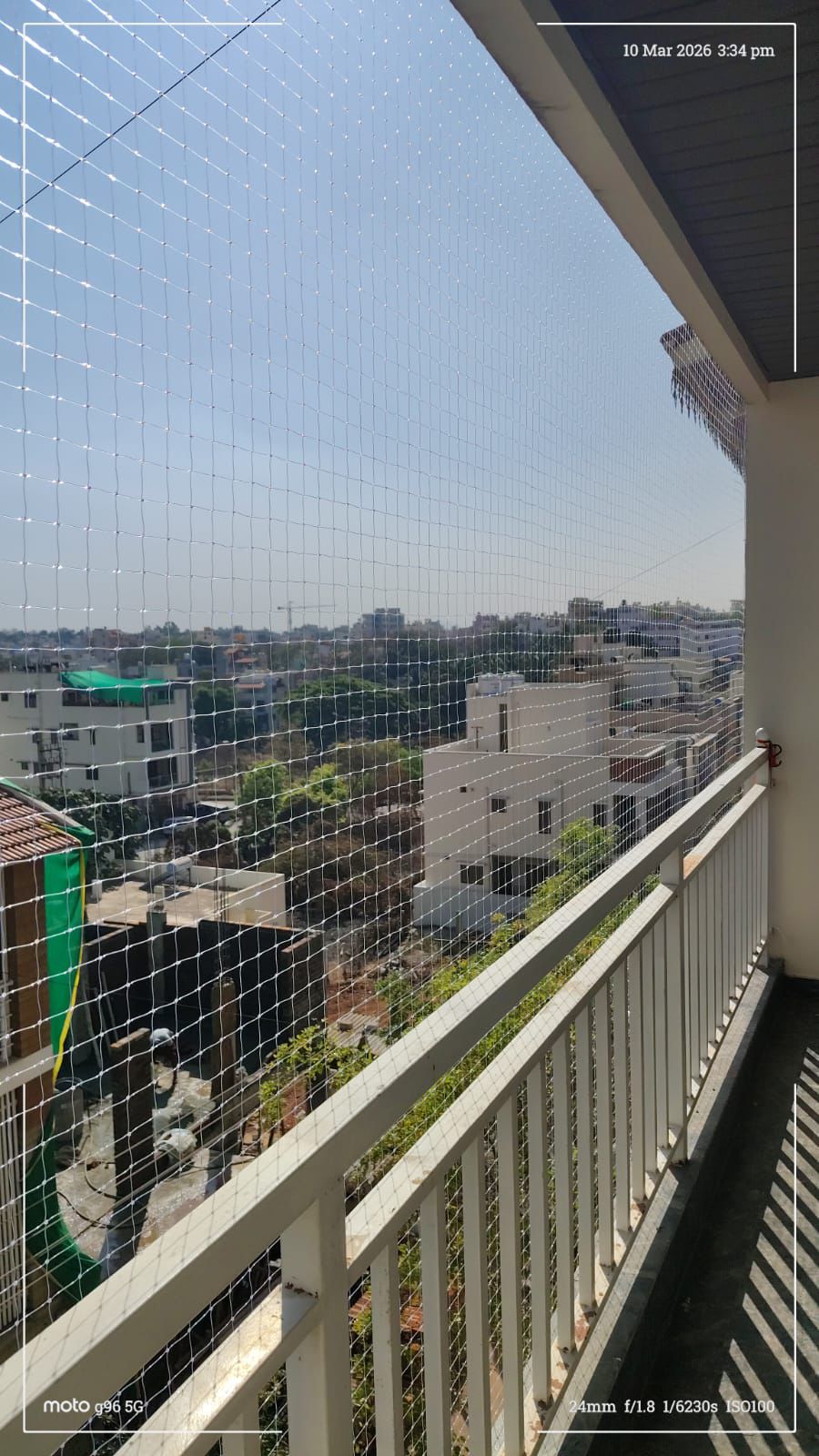 Safety net installed on apartment balcony in Andrapradesh — transparent ISI certified HDPE net tensioned across open balcony preventing falls for children and pets